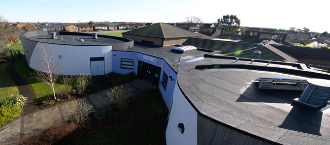 designing flat roofs school reroofing