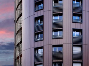 Elzinc Rainbow Pigmented Zinc cladding in Red - The Ellipse