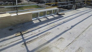 Heavy weight concrete roof deck over a masonry structure