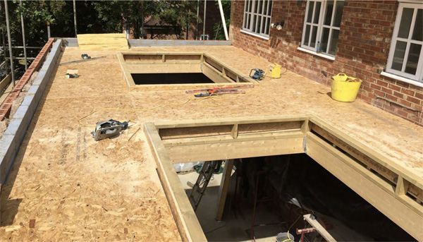 Lightweight timber roof deck over a brickwork structure