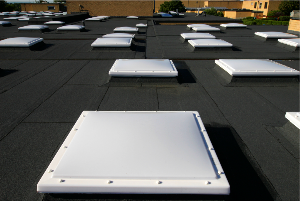 Opal tint standard specification domed rooflights in a built up bituminous flat roof